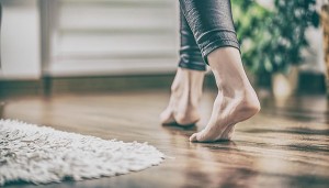 woman walking on hardwood floor